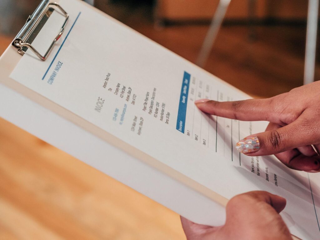 Commercial invoice template in the hand of human