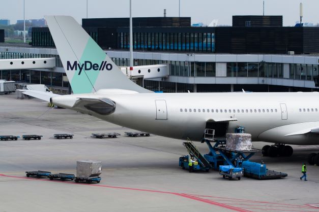 Aiplane at airport with MyDello logo
