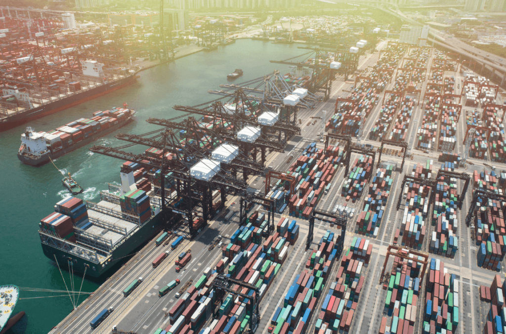 MyDello's logistics technology in action: A busy international port overflowing with neatly stacked containers representing global trade.